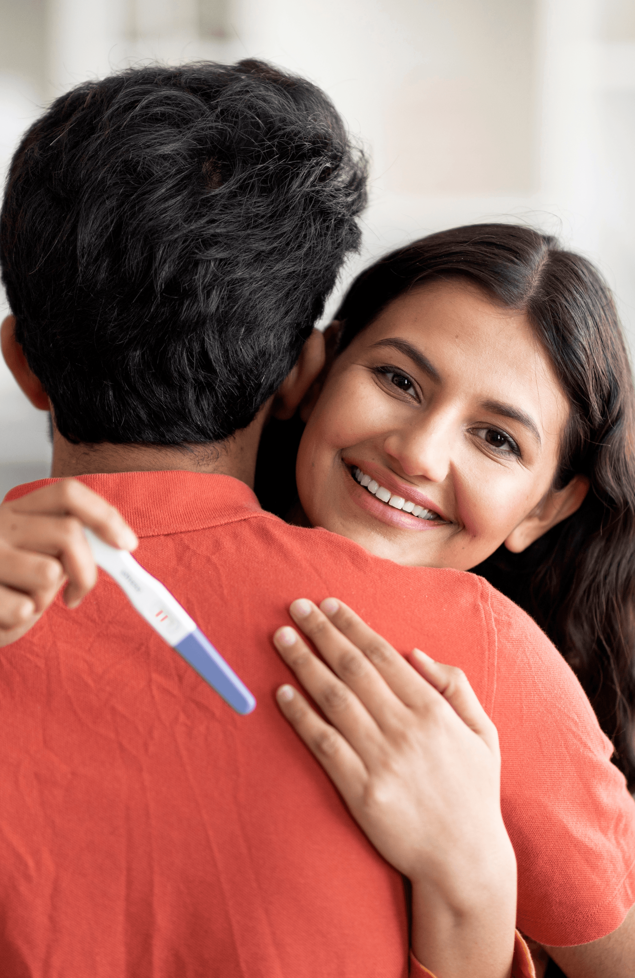 Couple hugging, hopeful